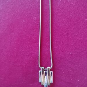 Vintage 1976 geometric gold tone and silvertone necklace on goldtone snake chain